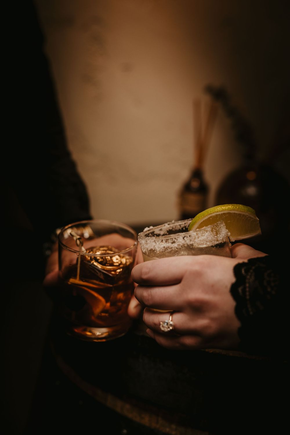 Couple cheers glasses in Livingston in the Historic Murray Hotel. Captured by Local Paradise valley Wedding photographer - Emigrant, Montana