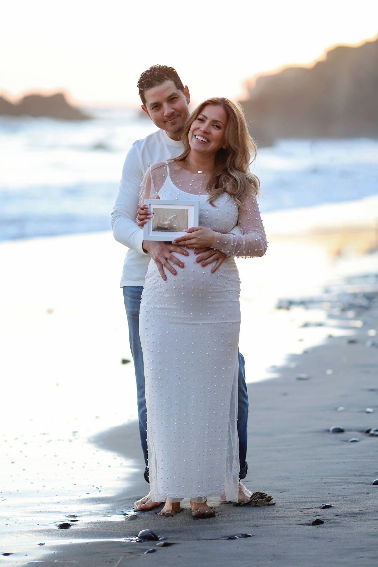 Expecting mother in a black gown during a studio maternity photography session in Ventura County.