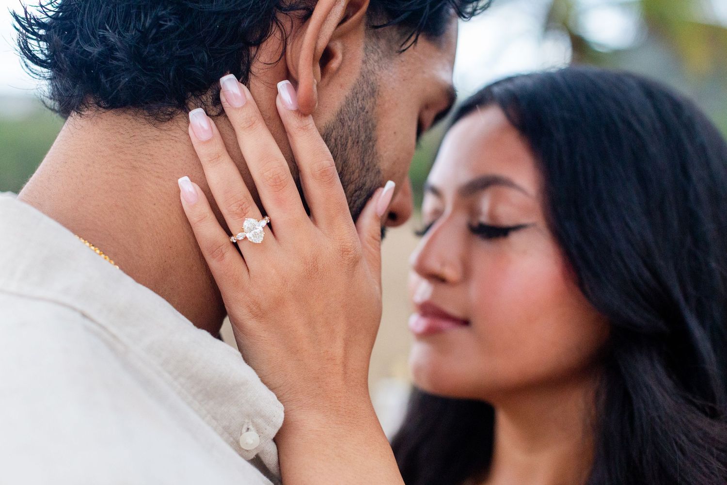 Engagement portrait on the beach. Ring shot. Playa Guajataca, Isabela, Puerto Rico.