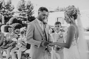 Black and white photo montage showing a couple's first dance and reception moments at an outdoor wedding celebration.
