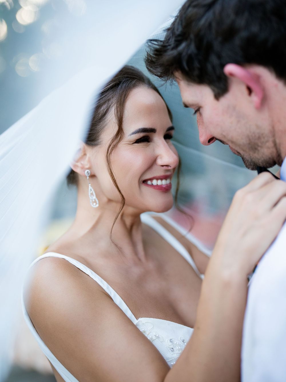 A romantic moment between newlyweds at their wedding ceremony with soft lighting and elegant styling.
