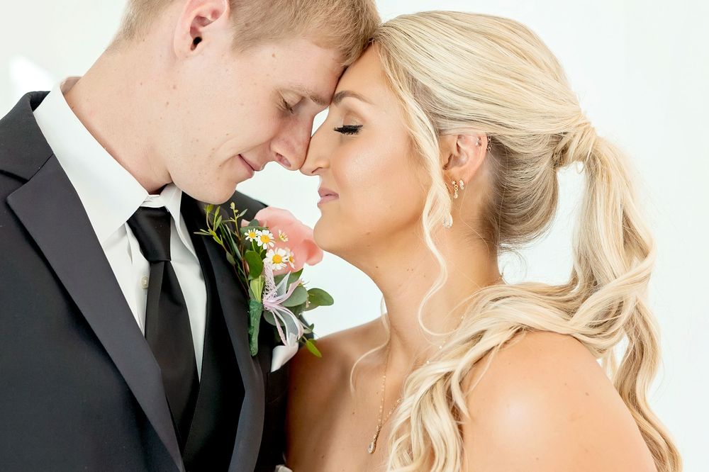 Romantic close-up wedding photography against white background with elegant styling.