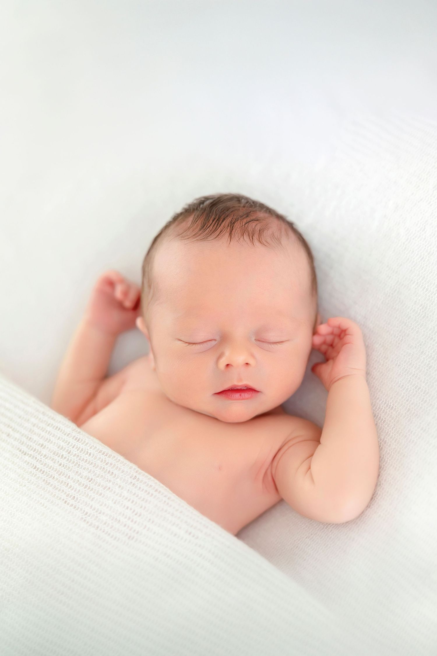 Sleeping newborn baby portrait by Clear Lake, Iowa newborn photographer Brittany Mueller Photography