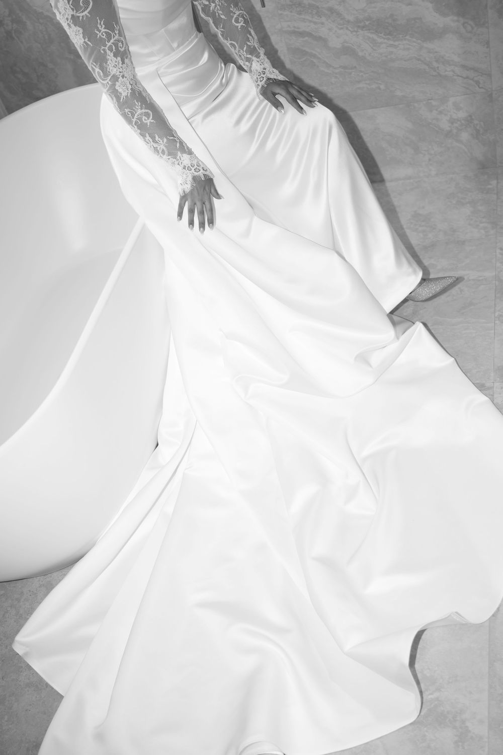 A flowing white wedding dress with dramatic movement and fabric swirls captured in a series of artistic photographs.