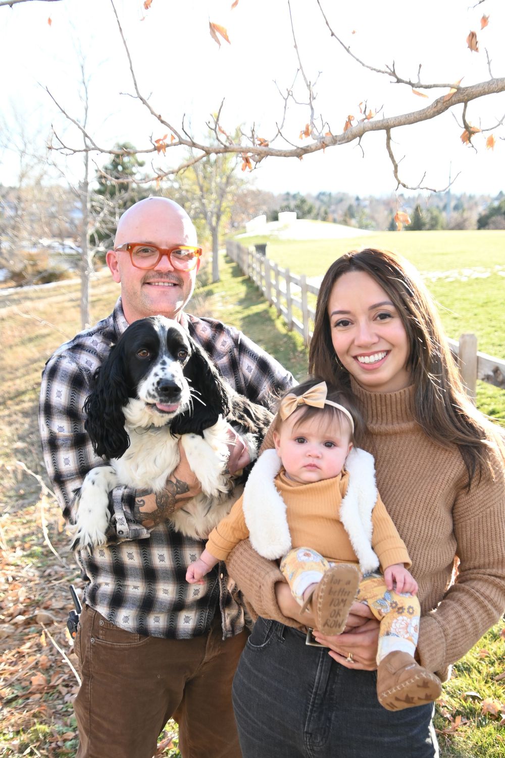 A series of candid outdoor photos showing people holding and interacting with a black and white border collie dog.