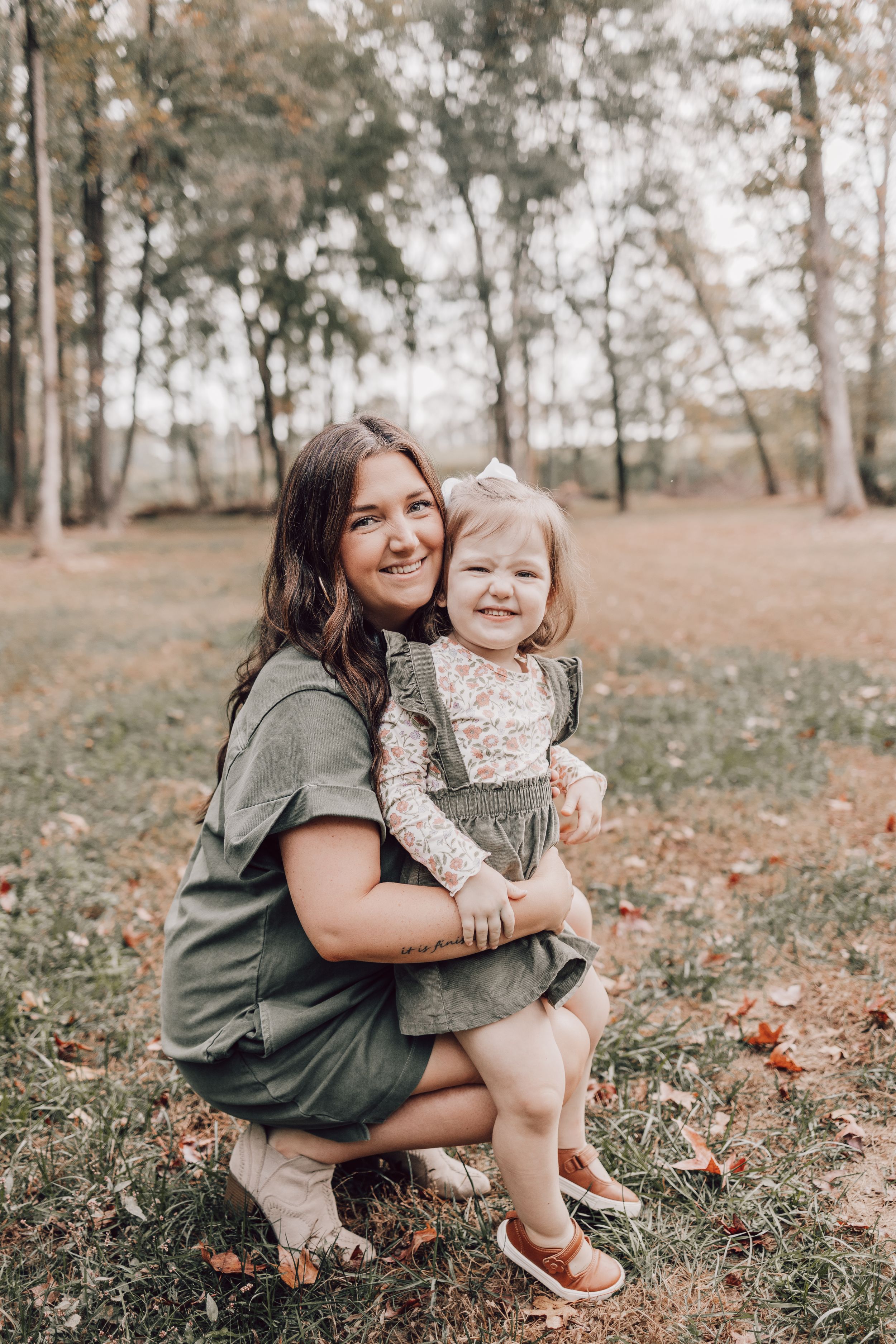 A heartwarming series of candid moments captured in a wooded outdoor setting during autumn.
