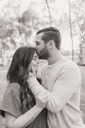 A romantic series of intimate black and white portraits showing tender moments between a couple.