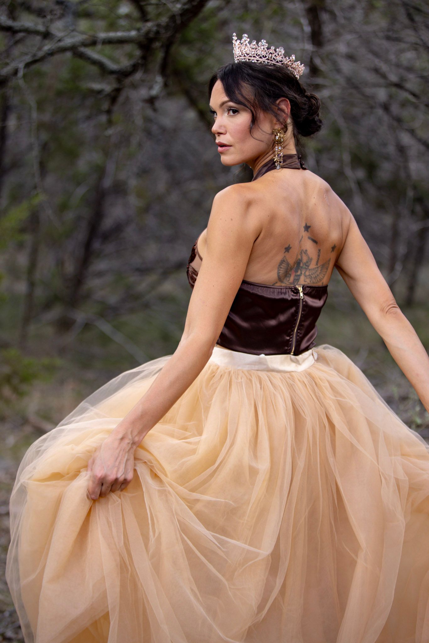 Elegant ballgown with brown bodice and champagne tulle skirt photographed outdoors.