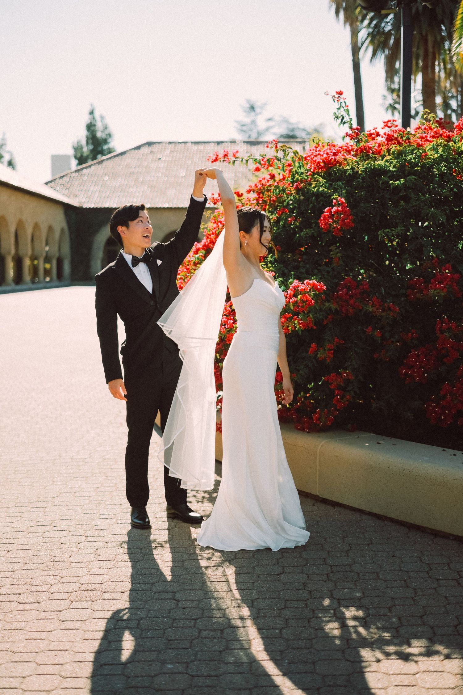 Intimate wedding portrait of couple in formal attire sharing tender moment.