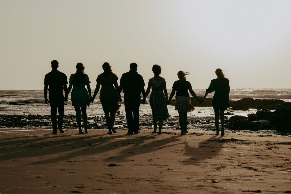 A family posing for a picture on the beach in Swakopmund