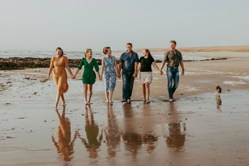 A family posing for a picture on the beach in Swakopmund