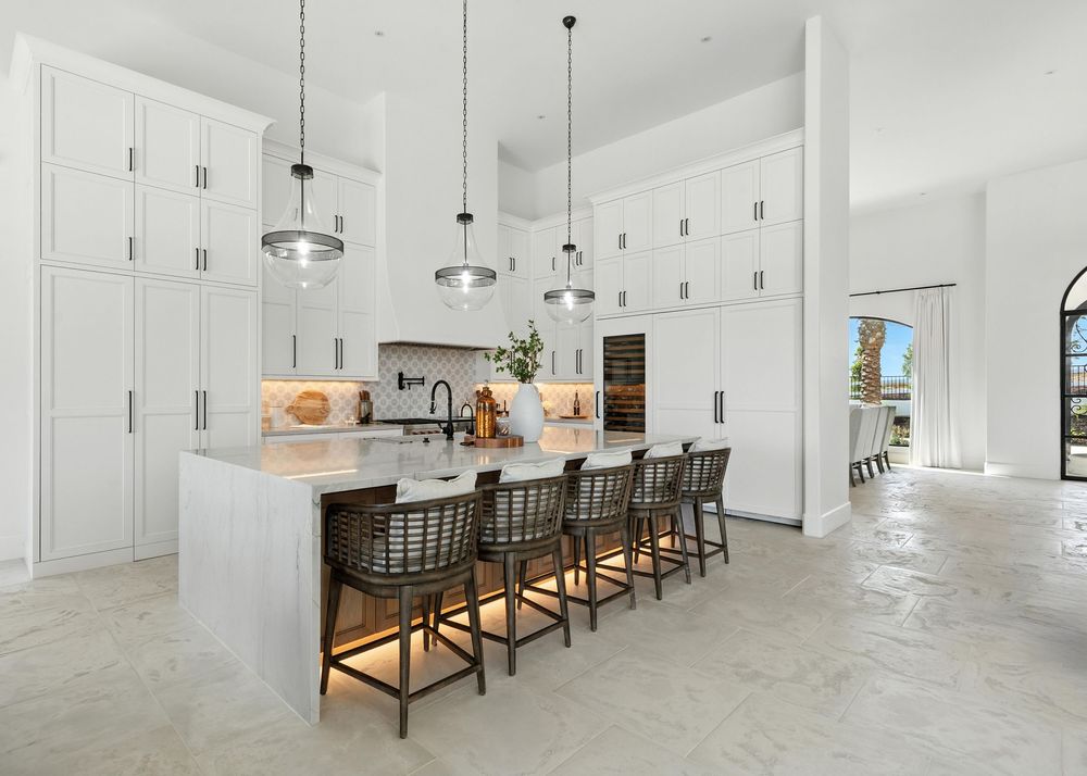 Five connected images show a bright modern open-concept space with clean white walls, wooden furniture and polished concrete floors.