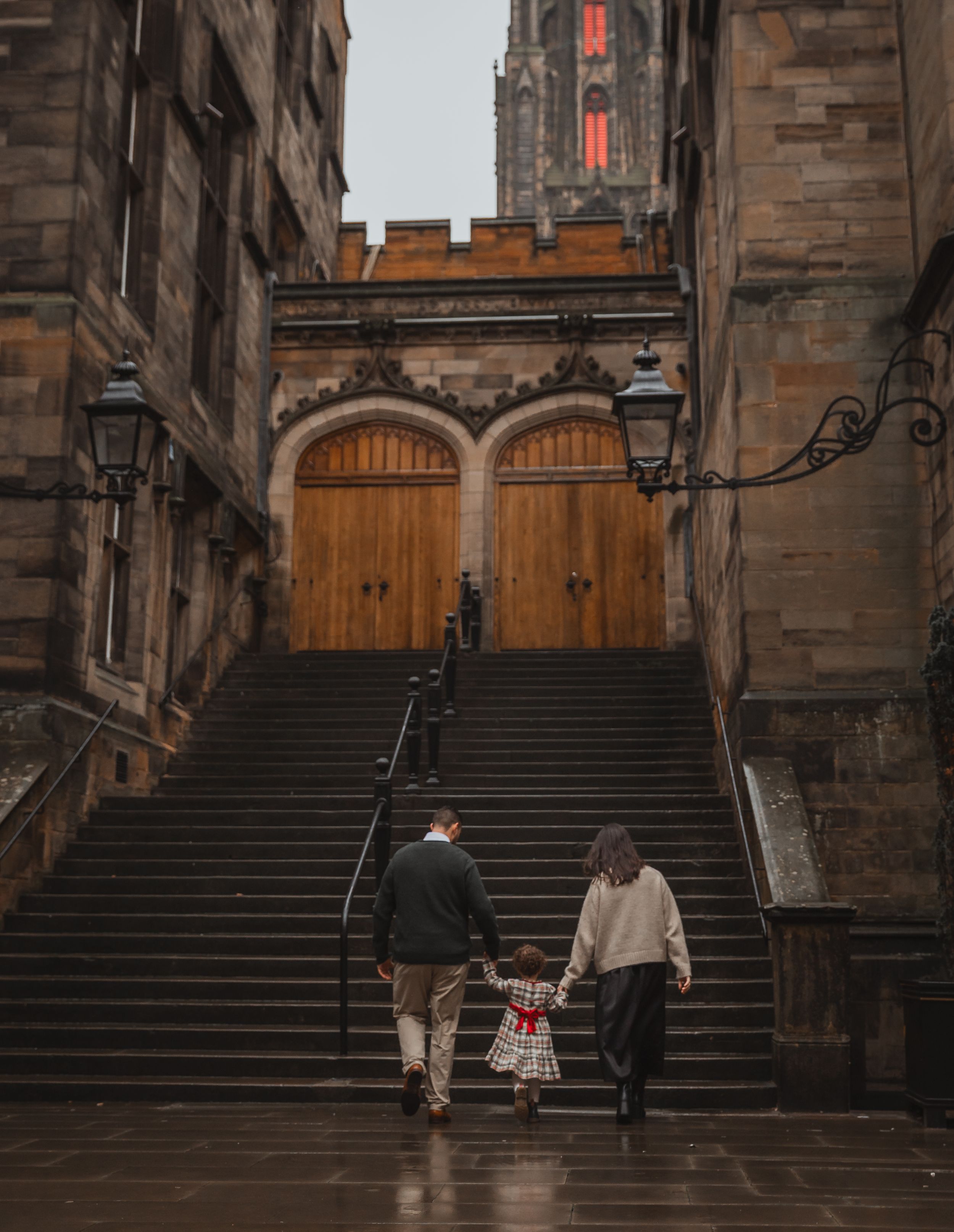 Historic stone staircase with ornate architecture and lanterns in Edinburgh's old town.