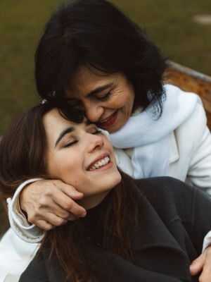 A candid series of joyful expressions and laughter captured in black and white tones.