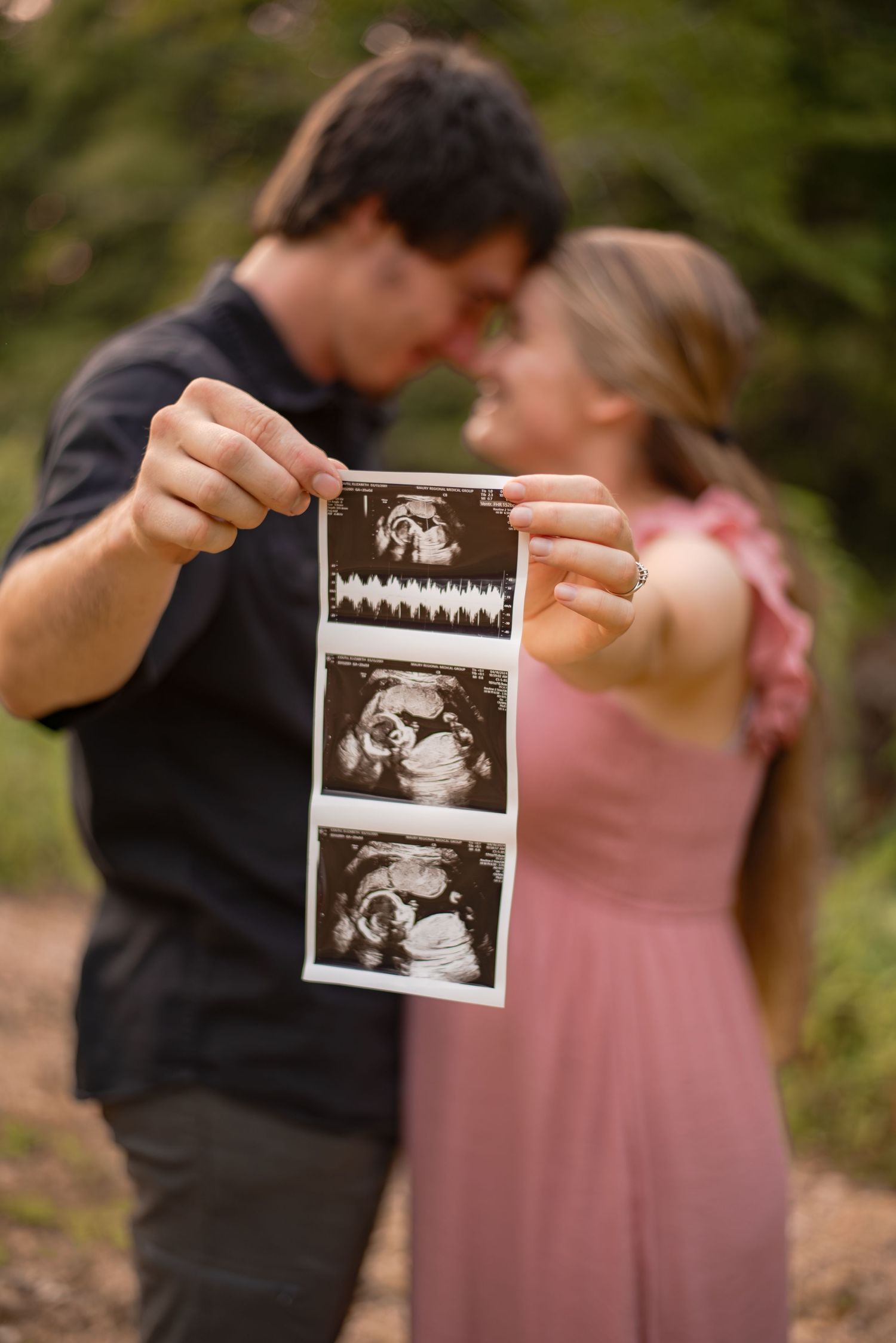 Baby announcement in Hohenwald Tennessee outside of Nashville. Sonogram or ultrasound being help by first time parents!