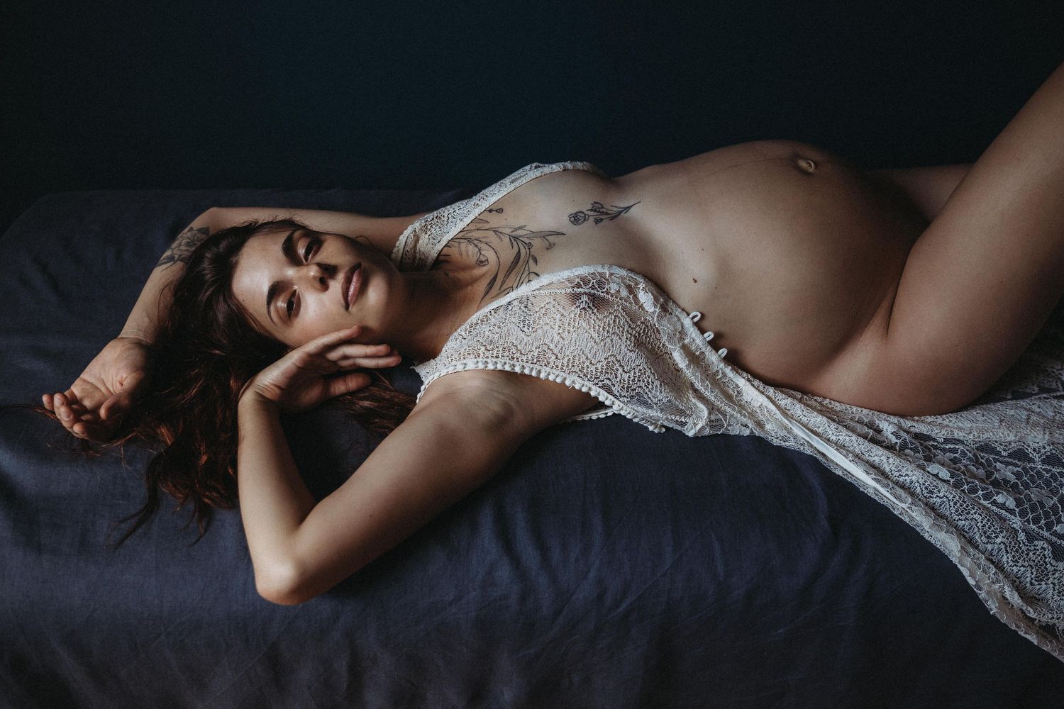 newborn photography london prices and packages for portrait of baby breastfeeding from mother
