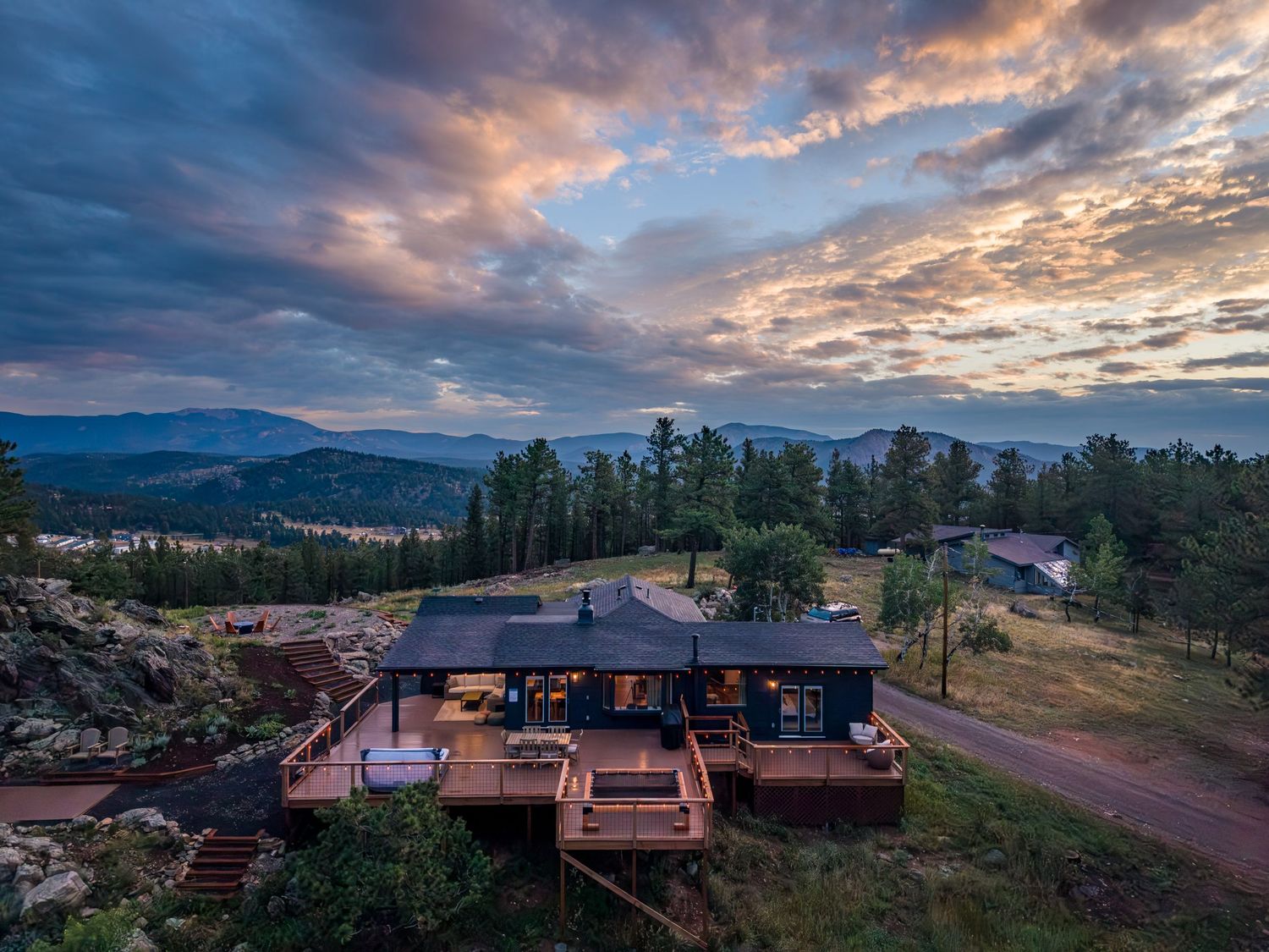 Aerial/drone shot of a luxury vacation rental at sunrise in Bailey, CO.