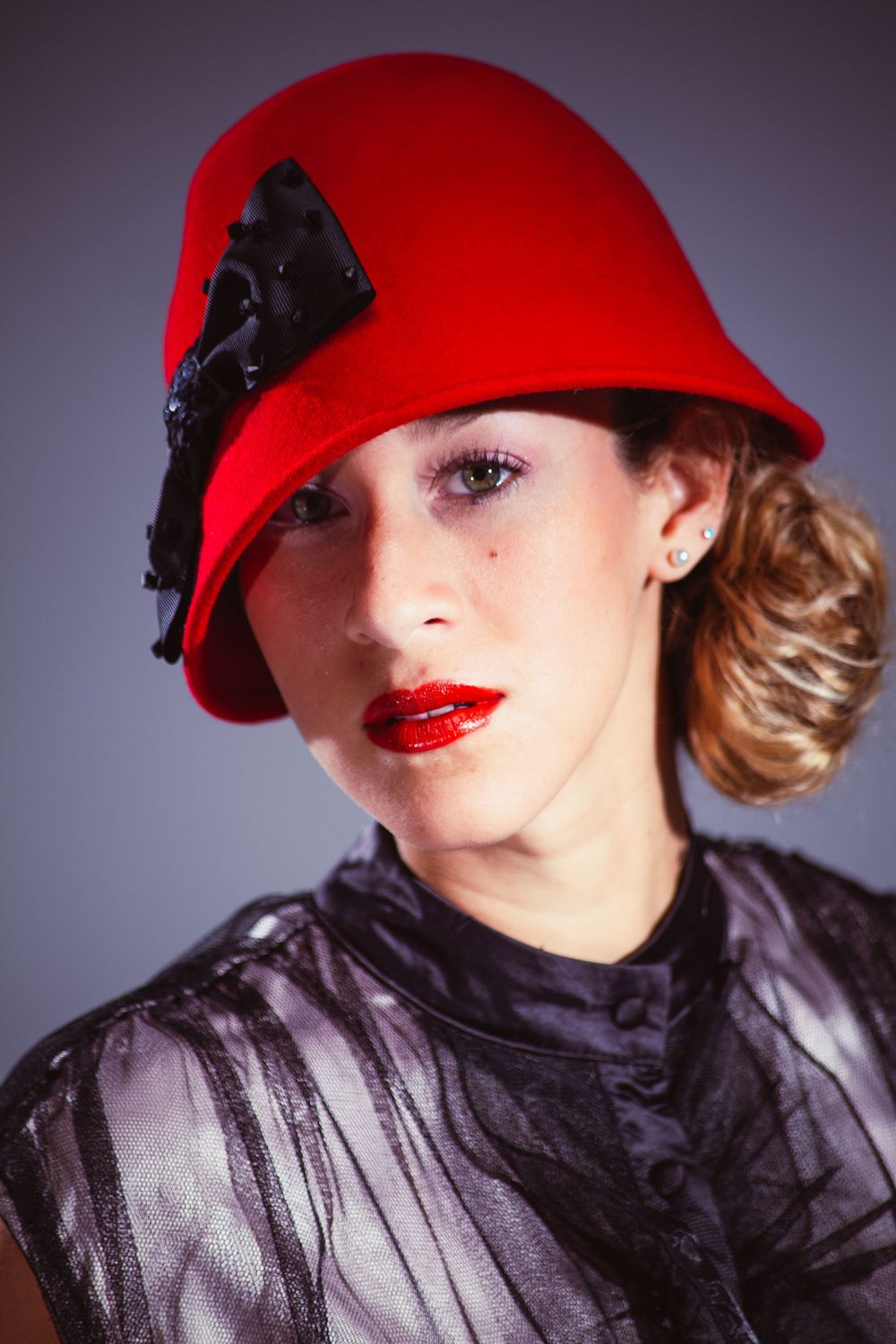 Stylish fashion shots featuring a red beret and black scarf against a dark background.