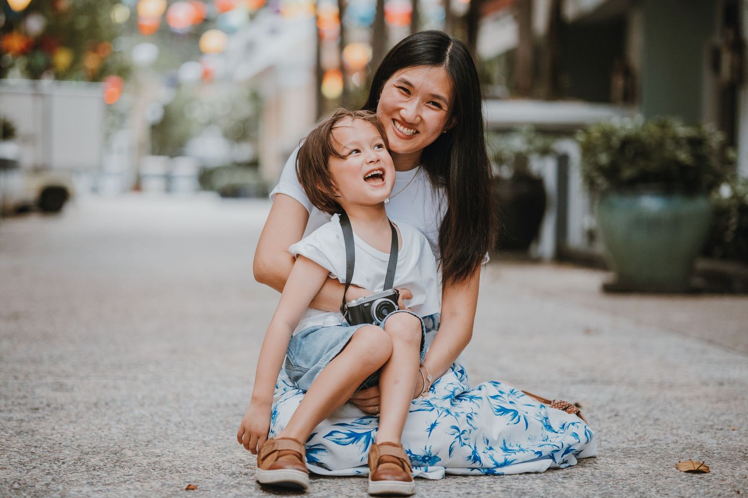 Mom and son laughing at moments together