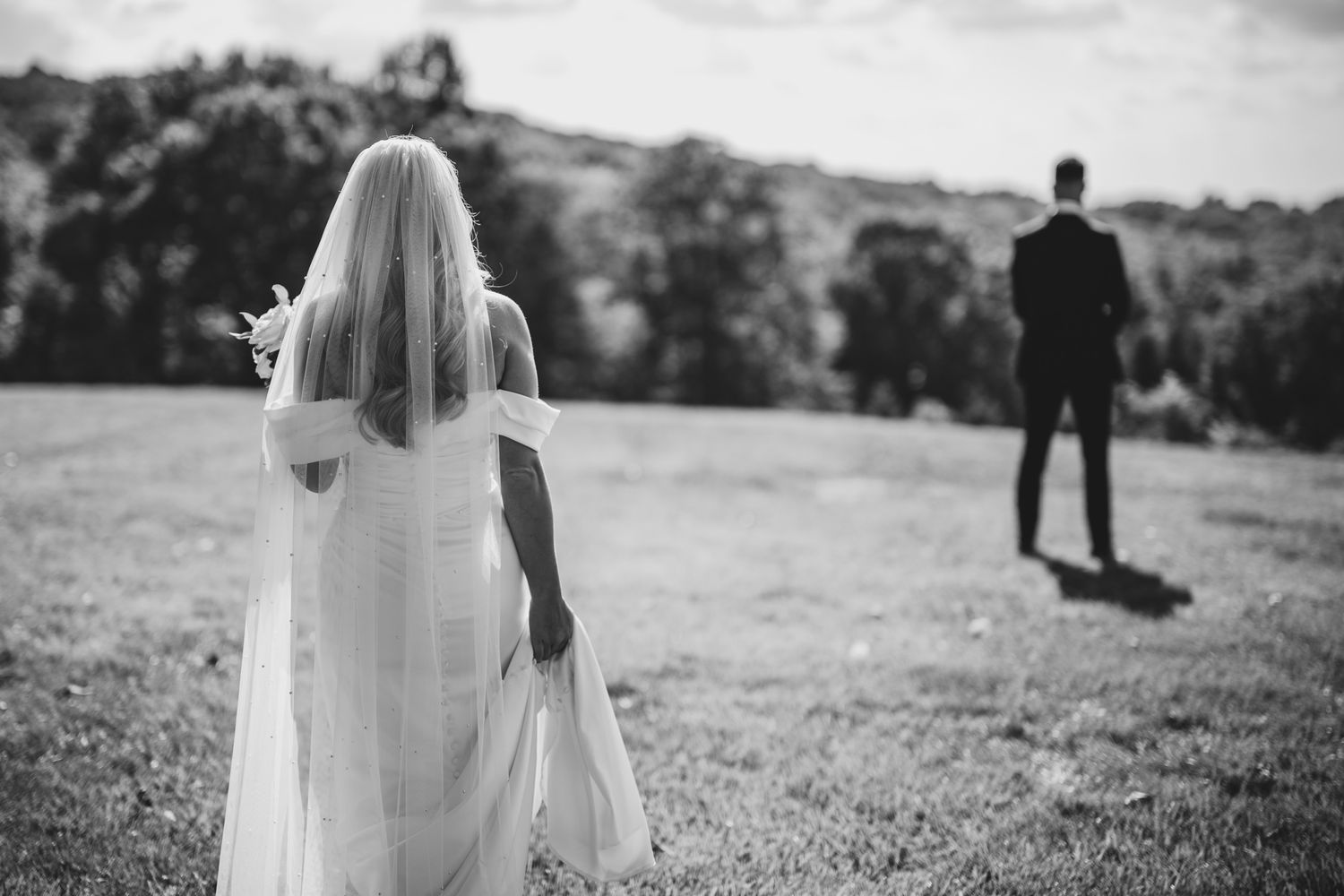 moment just before first look  bride walking up to groom