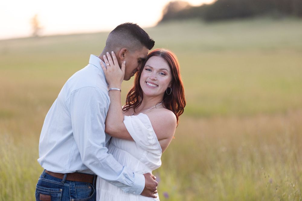 Engagement session in upper park, bidwell park, Chico, California with green grass in the background and plateau