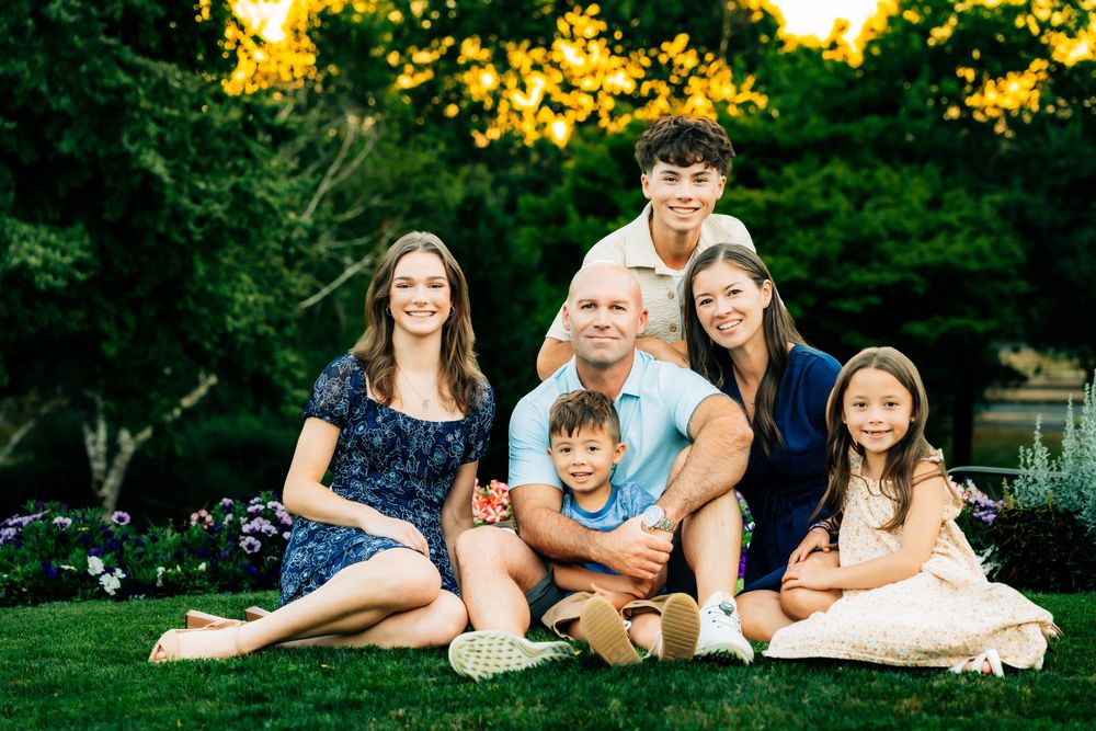 A series of outdoor family photos taken in a lush green park setting during golden hour.