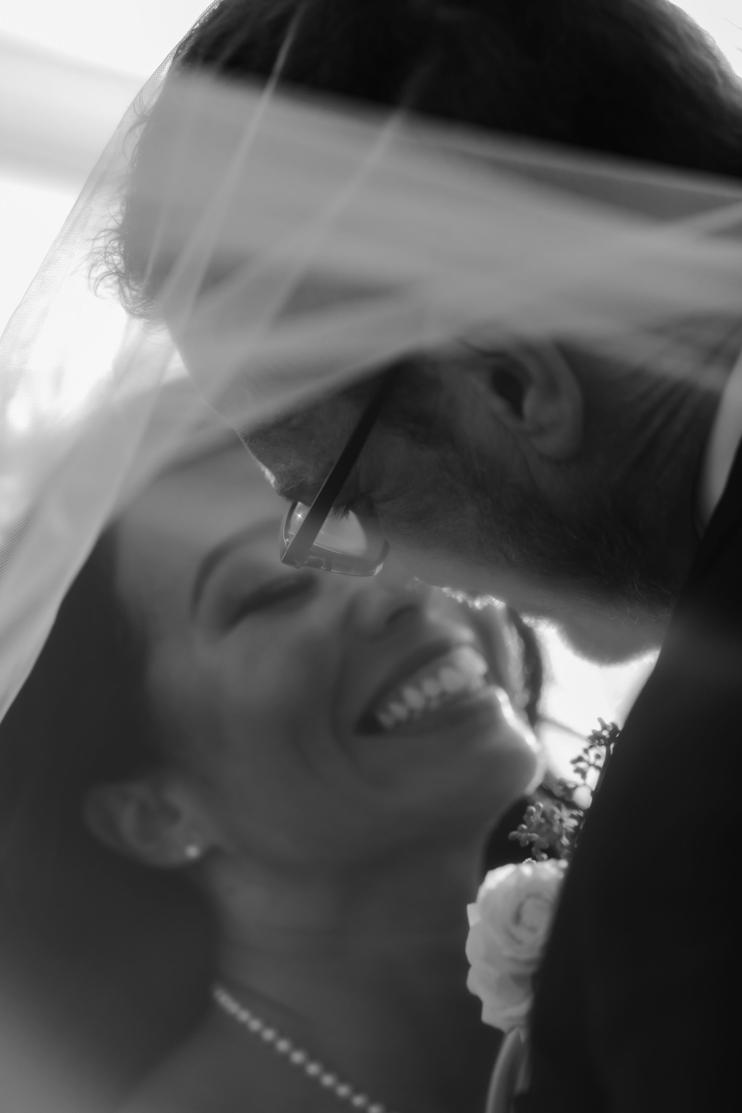 Bride laughing during candid wedding moment