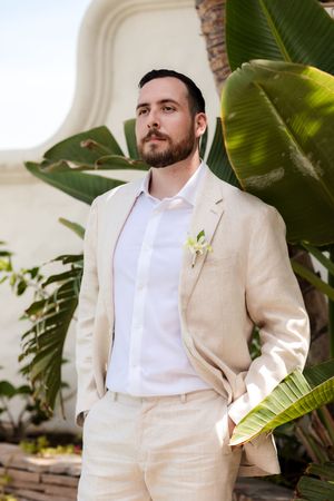 Groom waiting at altar during beach ceremony