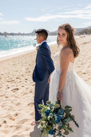 Romantic wedding portrait with dramatic sky
