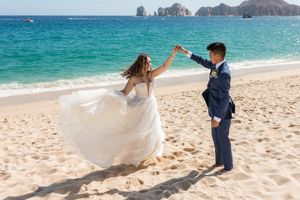Wedding couple embracing during golden hour in Los Cabos