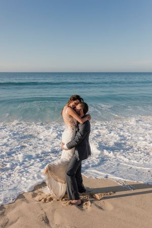 Romantic wedding kiss with ocean view in Cabo San Lucas