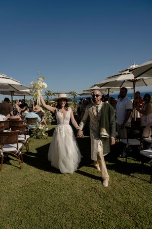 Wedding guests celebrating on beach in Cabo
