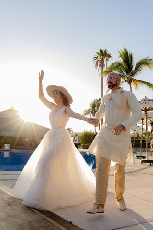 Wedding guests celebrating on beach in Cabo