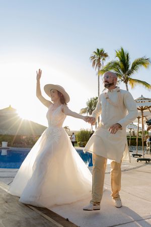 Bride and groom silhouette during sunset in Los Cabos