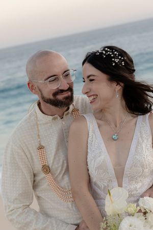 Groom smiling during emotional wedding moment