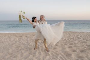 Emotional hug during wedding celebration in Cabo