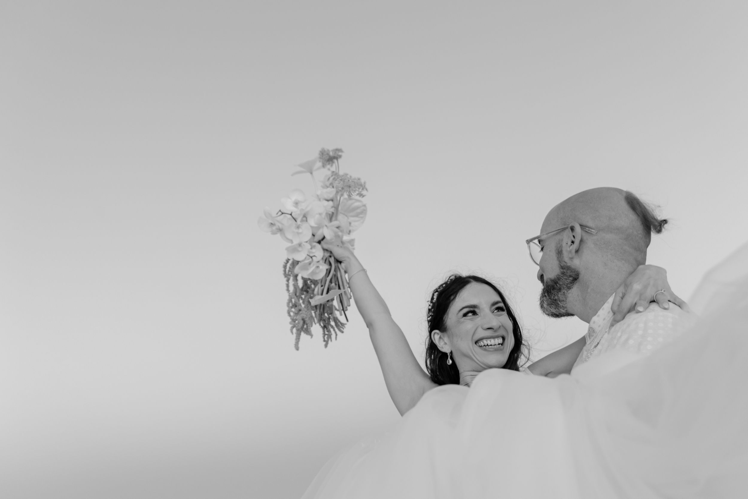 Romantic wedding kiss with ocean view in Cabo San Lucas