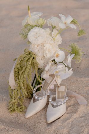 Wedding rings close-up with beach background