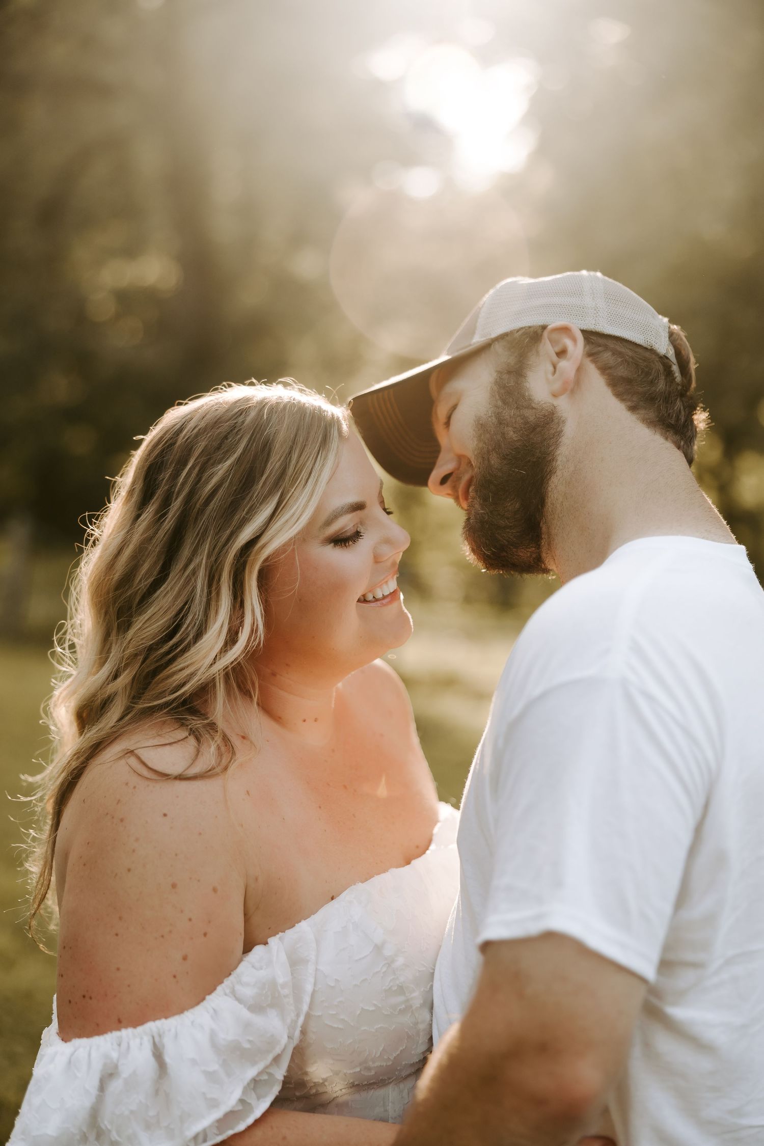 A romantic sunset photoshoot in a golden field.