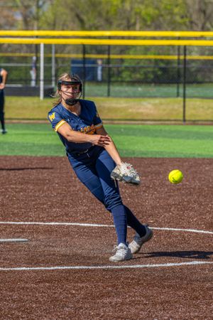 Womens Softball pitcher mid pitch