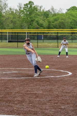 Wissahickon Highschool softball pitcher warming up on the baseball field
