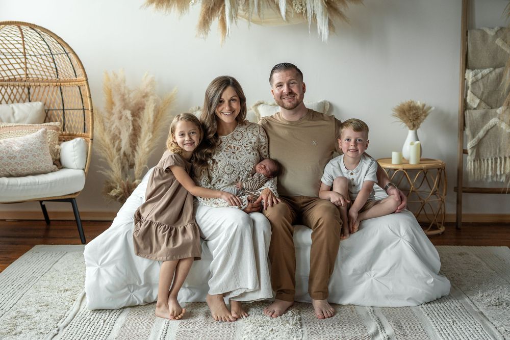 A collection of cozy family lifestyle photos showing people relaxing together on white bedding in natural light settings.