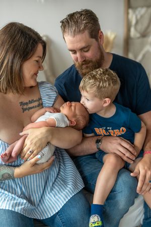 A family of three shares tender moments in a series of candid photos showing affection and closeness.