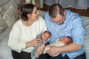 A series of five connected photos showing parents lovingly interacting with their newborn baby in a hospital setting.