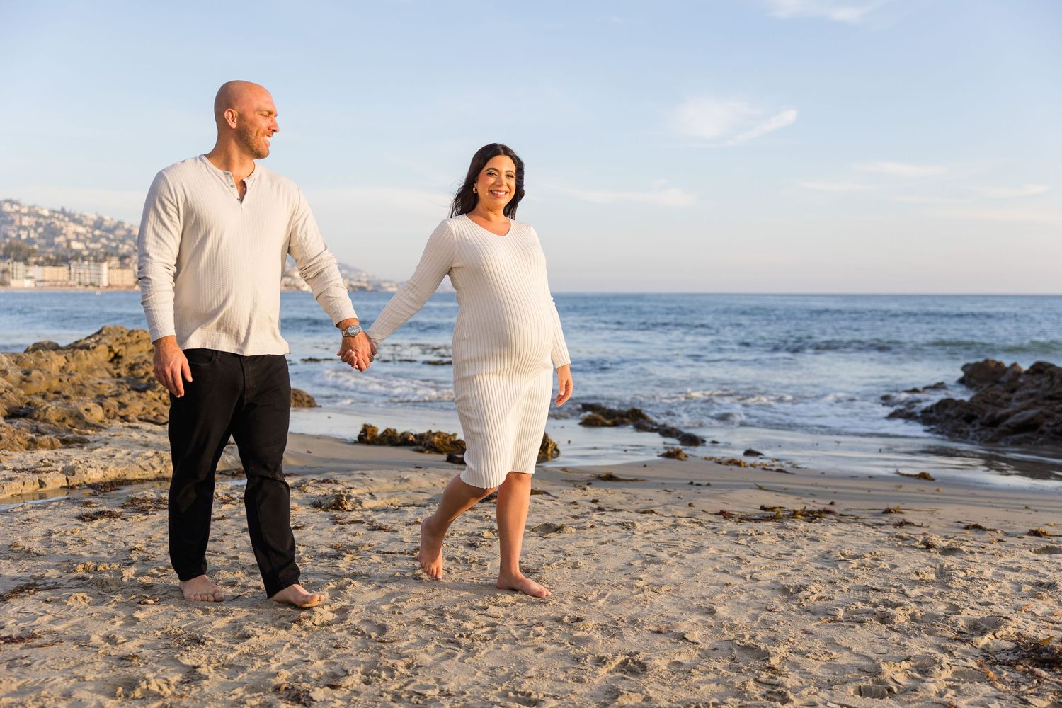 Maternity session with couple walking along the beach in Laguna Beach
