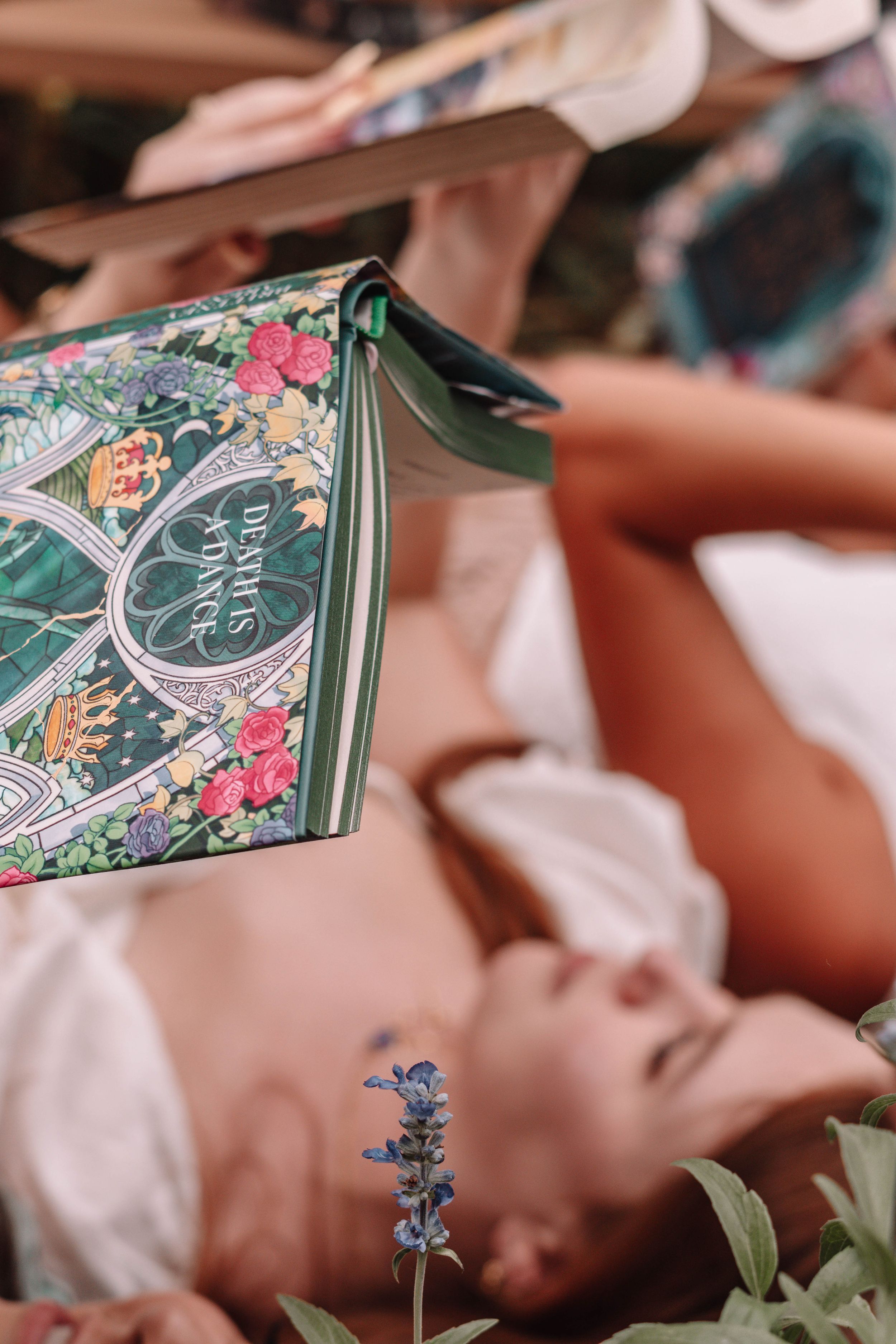 Close-up of vintage-style book covers with floral designs and decorative elements.