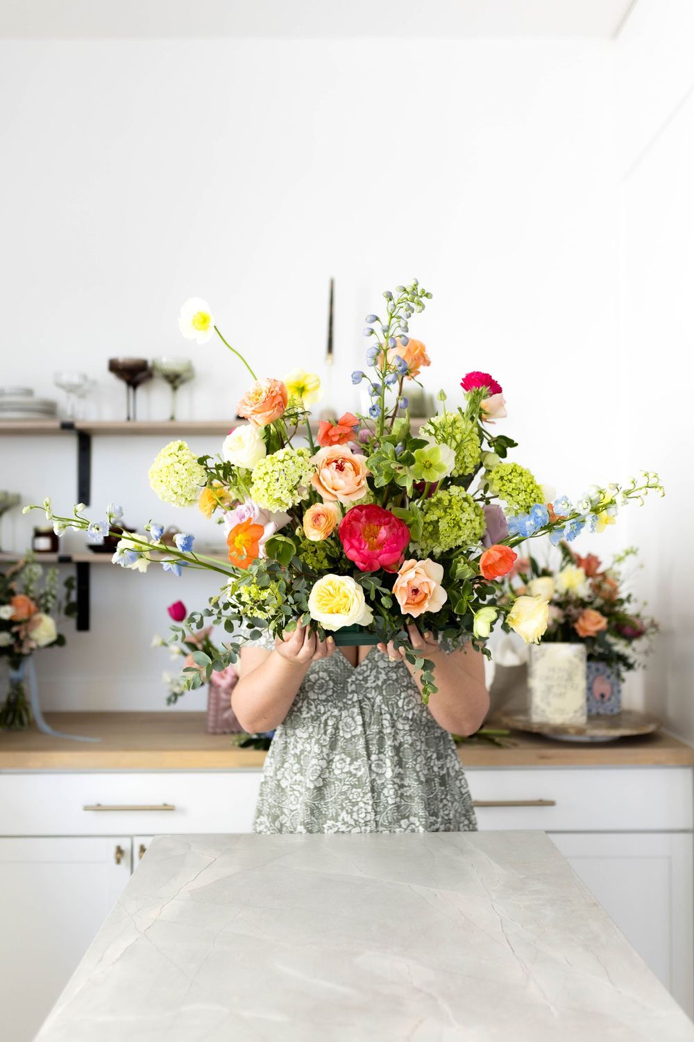 Flowers being held in front of face