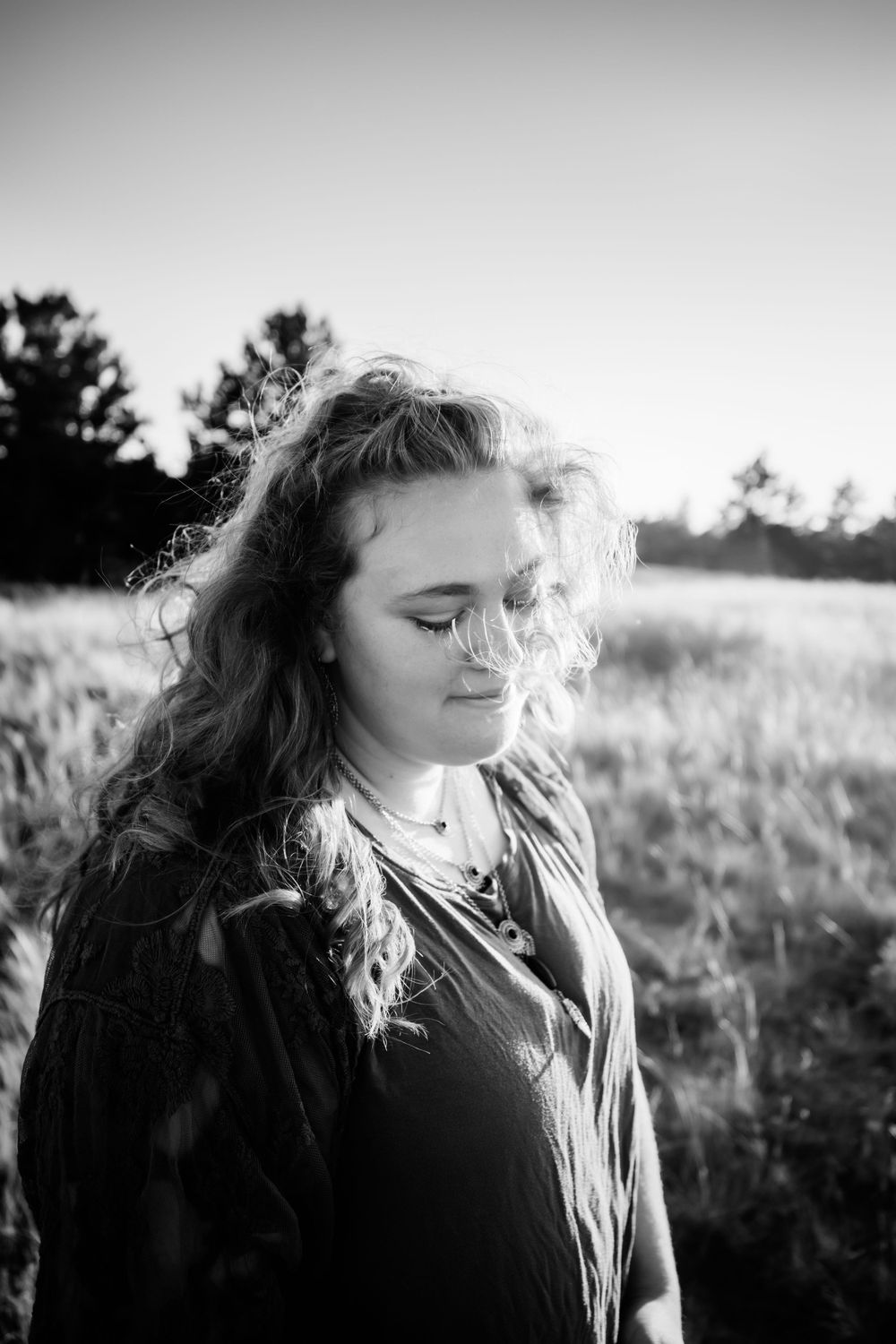 Senior girl smiles in black and white in Dickson, TN