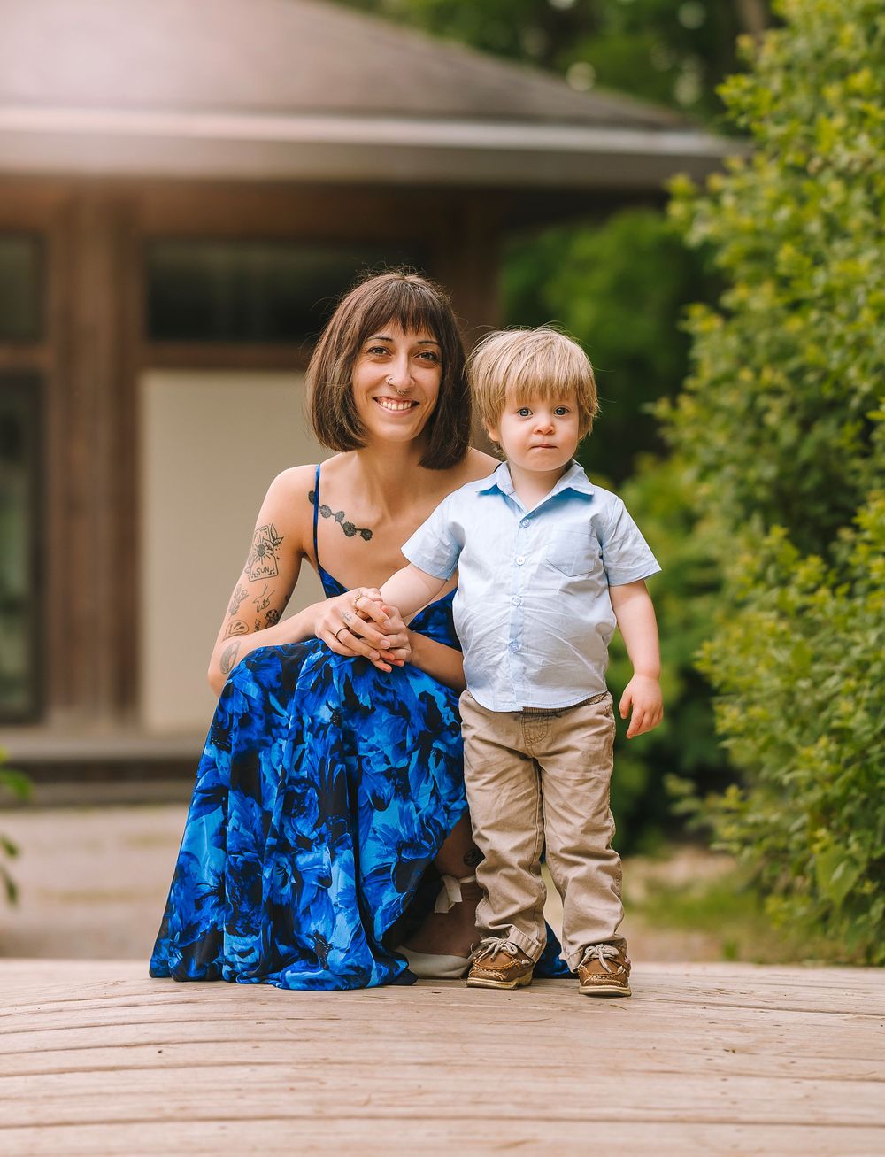 A progression sequence shows a child walking across a wooden deck with someone in a patterned blue dress holding them close.
