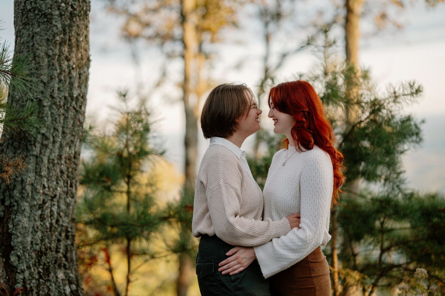 Engaged man and woman in hat kissing